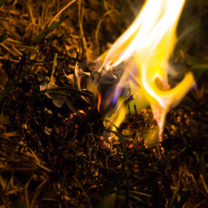 Burning ashes of a paper airplane