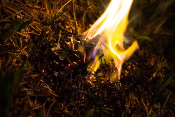 Burning ashes of a paper airplane