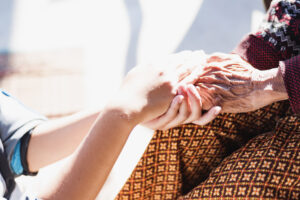 midsection-woman-holding-hands