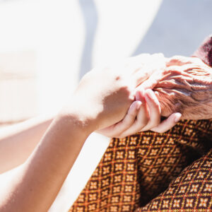 midsection-woman-holding-hands